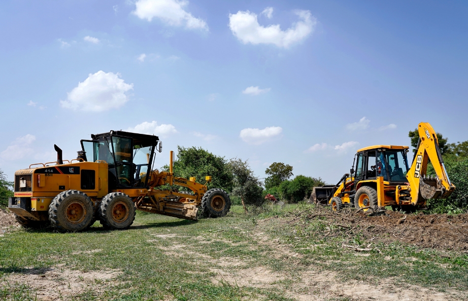 Two large tractor-trailer for fleet management construction parked in a field
